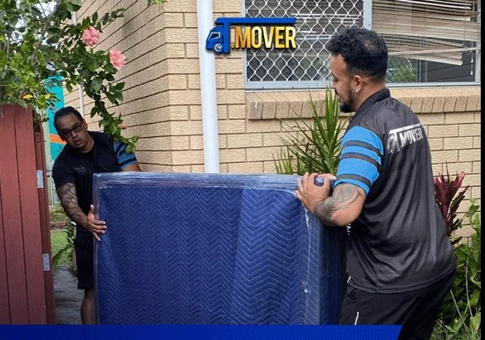 T-MOVERS team carefully moving wrapped furniture at Brisbane home